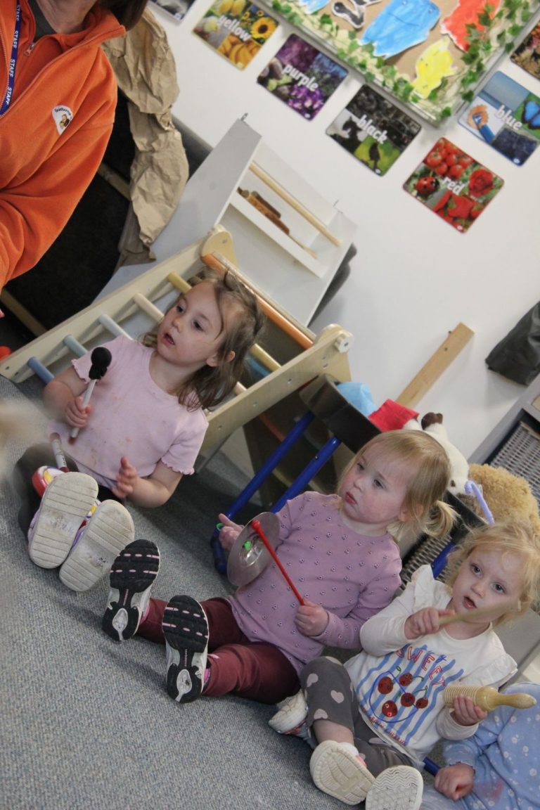 Toddlers playing instruments during a music and movement session